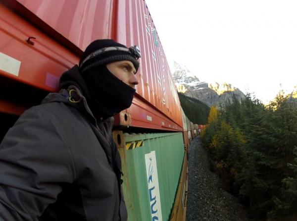 Brave Dave looks out at the Canadian Rockies whilst riding on a freight train