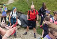 Brave Dave smiling at the camera whilst the group have a rest on Snowdon